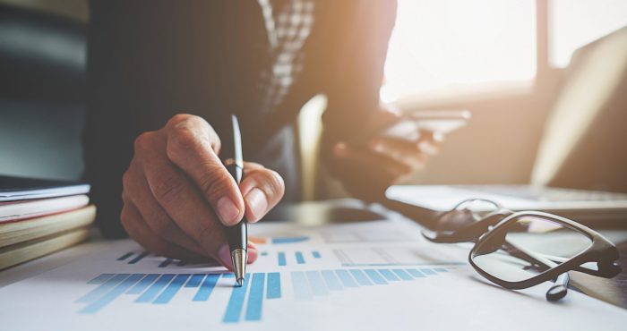 Business concept. Business people discussing the charts and graphs showing the results of their successful teamwork.